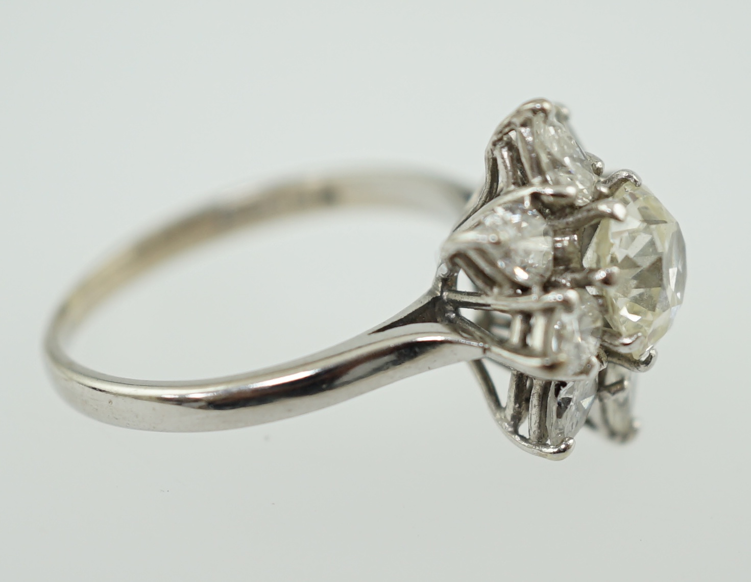 A modern 18ct white gold and diamond flower head cluster ring